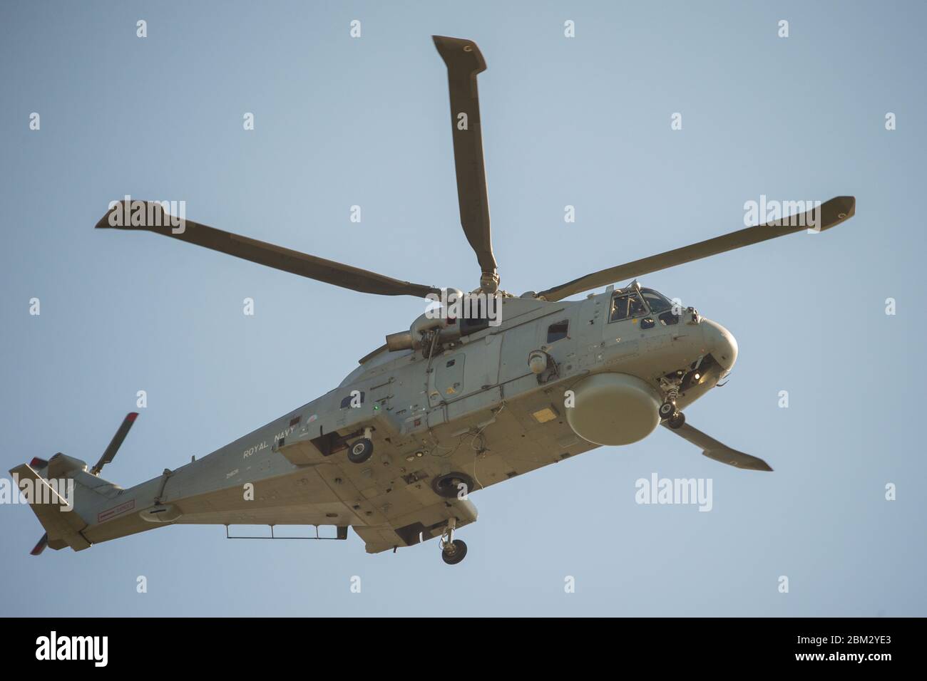 Close up of royal navy merlin helicopter flying above hires stock