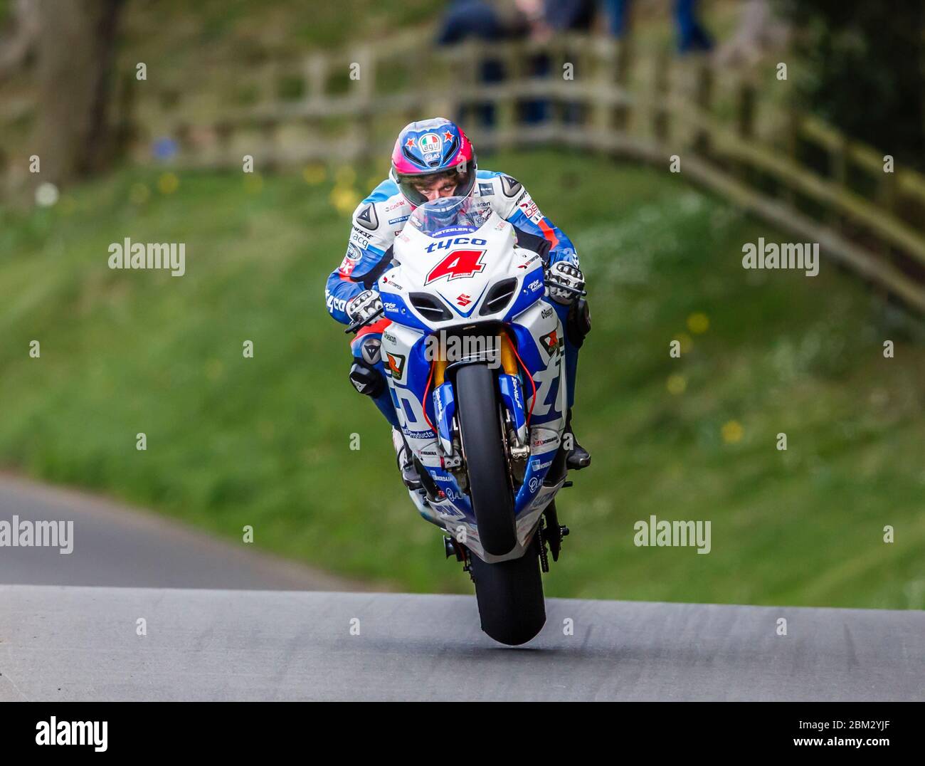Guy Martin skimming the ground as he crests Jeffries Jump at Olivers Mount motorcycle road racing circuit, Scarborough, North Yorkshire, England Stock Photo