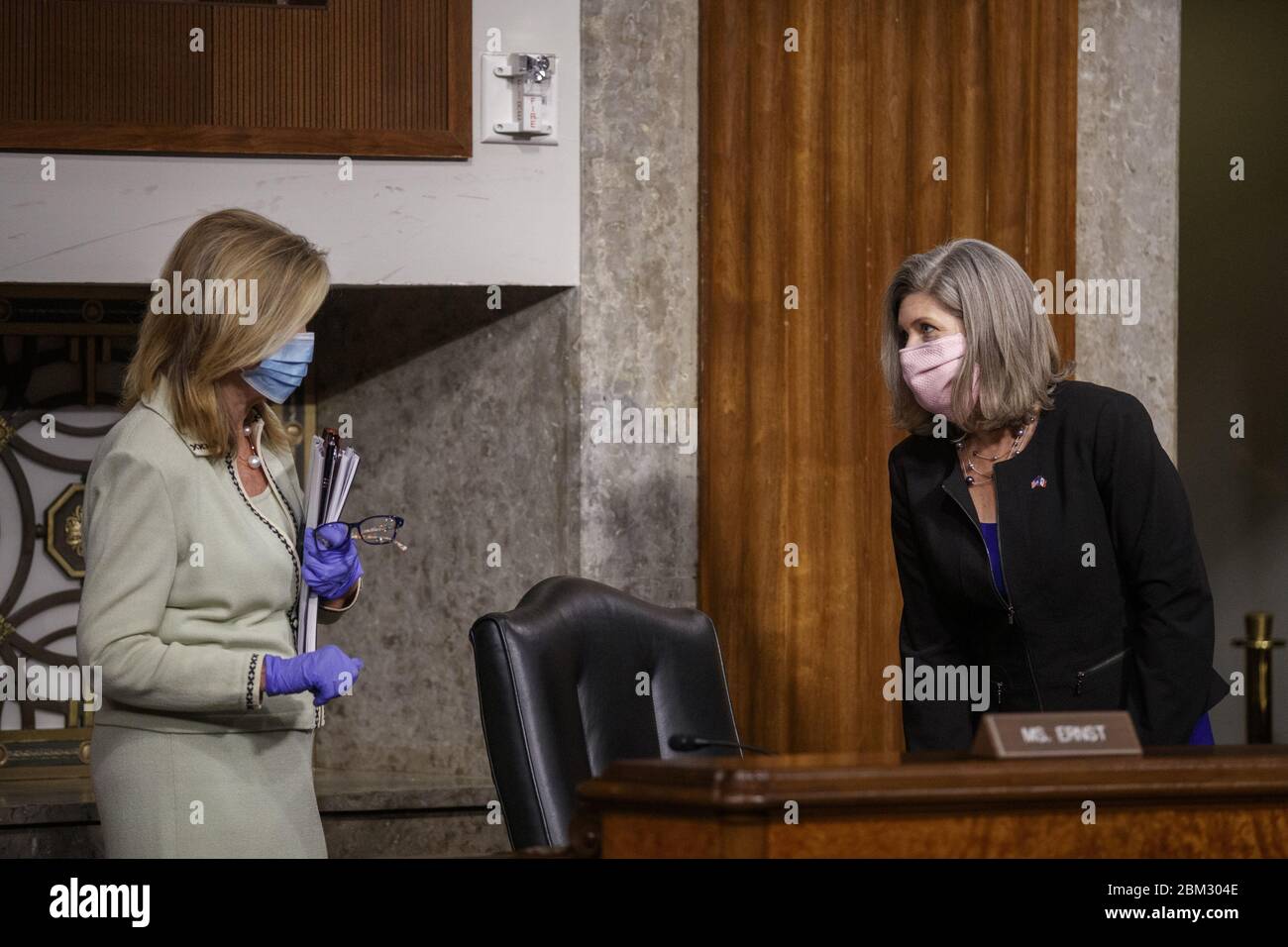 Washington, United States. 06th May, 2020. Republican Senator from Iowa Joni Ernst (R) talks with Republican Senator from Tennessee Marsha Blackburn (L) prior to the Senate Armed Services Committee hearing on the Department of Defense Spectrum Policy and the Impact of the Federal Communications Commission's Ligado Decision on National Security during the COVID-19 coronavirus pandemic on Capitol Hill in Washington, DC on Wednesday, May 2020. Pool Photo by Shawn Thew/UPI Credit: UPI/Alamy Live News Stock Photo