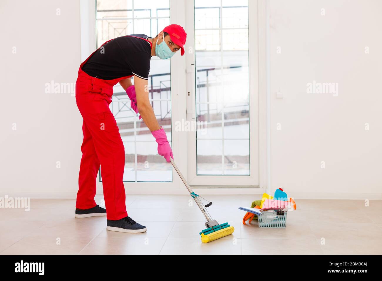 Cleaning and Disinfection at town complex amid the coronavirus epidemic. Professional teams for disinfection efforts. Infection prevention and control Stock Photo