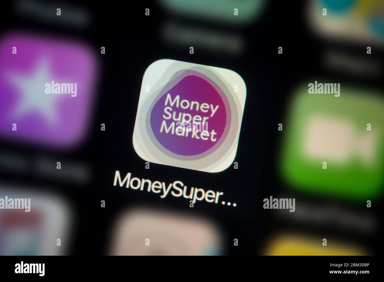 A close-up shot of the Money Supermarket app icon, as seen on the screen of a smart phone (Editorial use only) Stock Photo