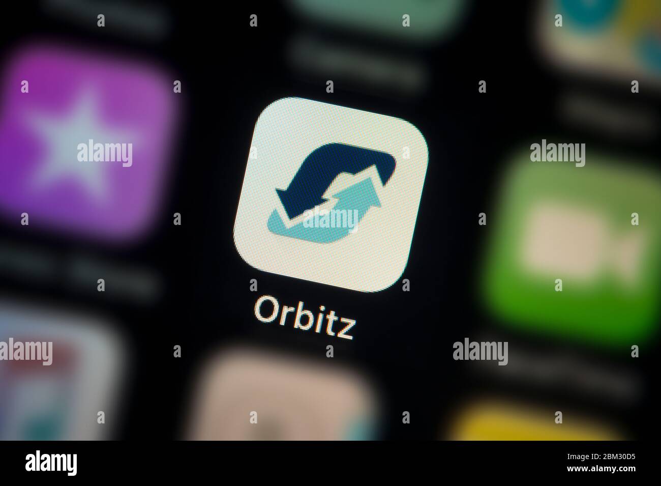 A close-up shot of the Orbitz app icon, as seen on the screen of a smart phone (Editorial use only) Stock Photo