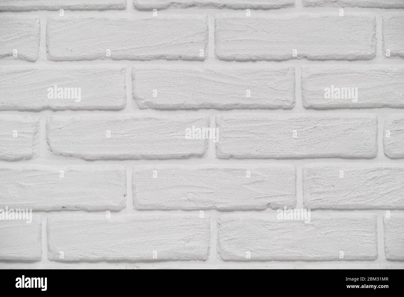 A white indoor brick wall abstract background or texture, new and clean ...