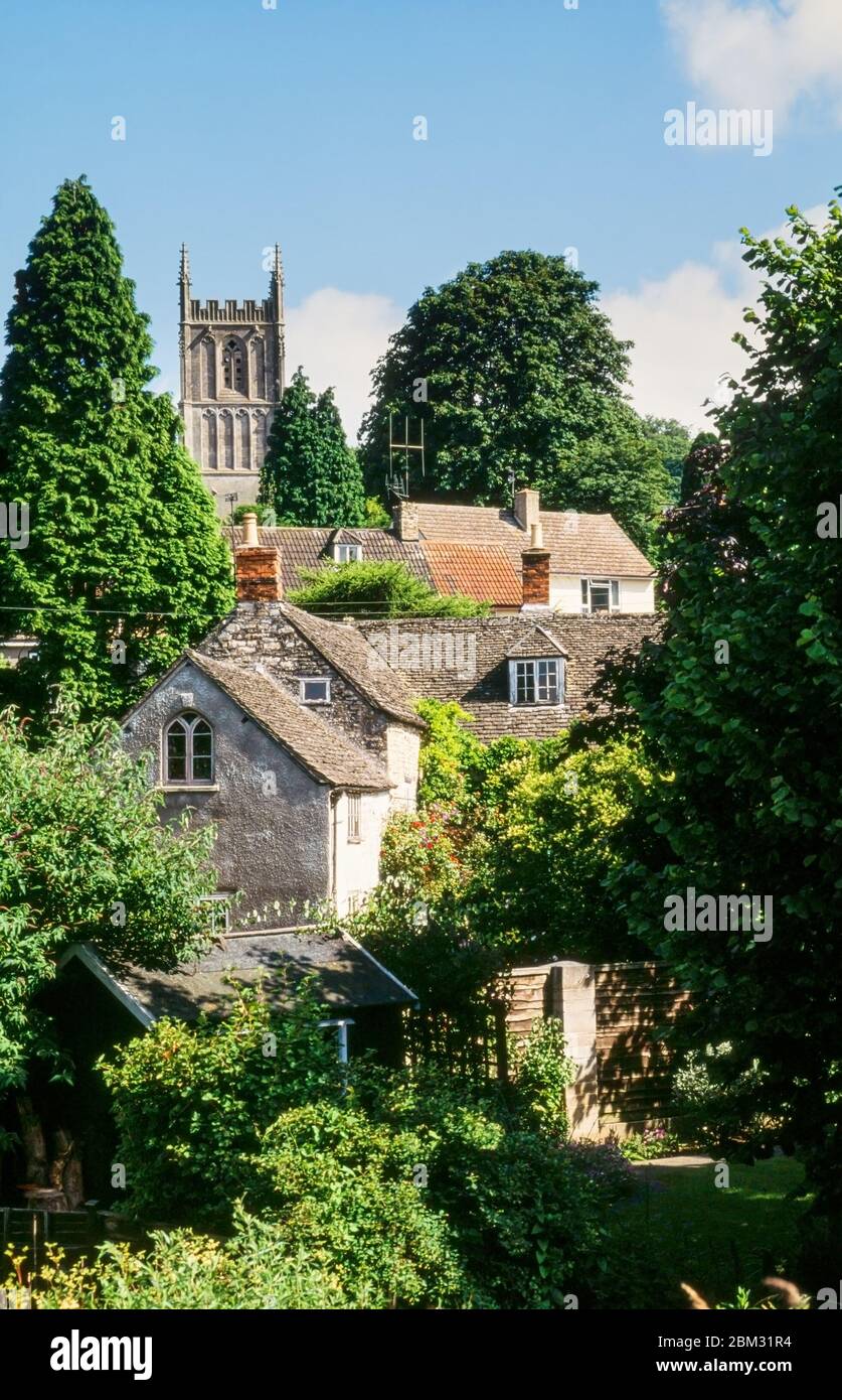 Old buildings and cottages with tower of St Mary's Church in the village of Wotton-Under-Edge in the Cotswolds, Gloucestershire, England, UK Stock Photo
