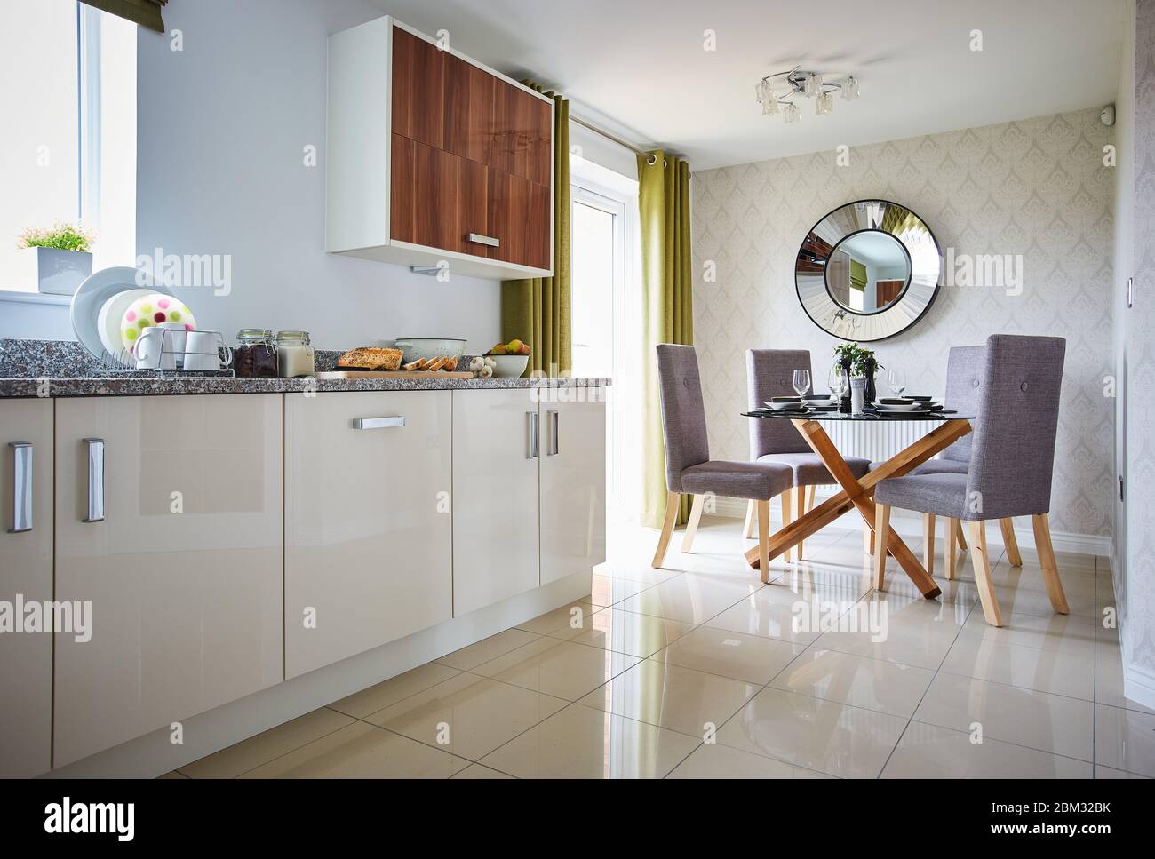 Modern interior of a large kitchen with dining table and chair Stock