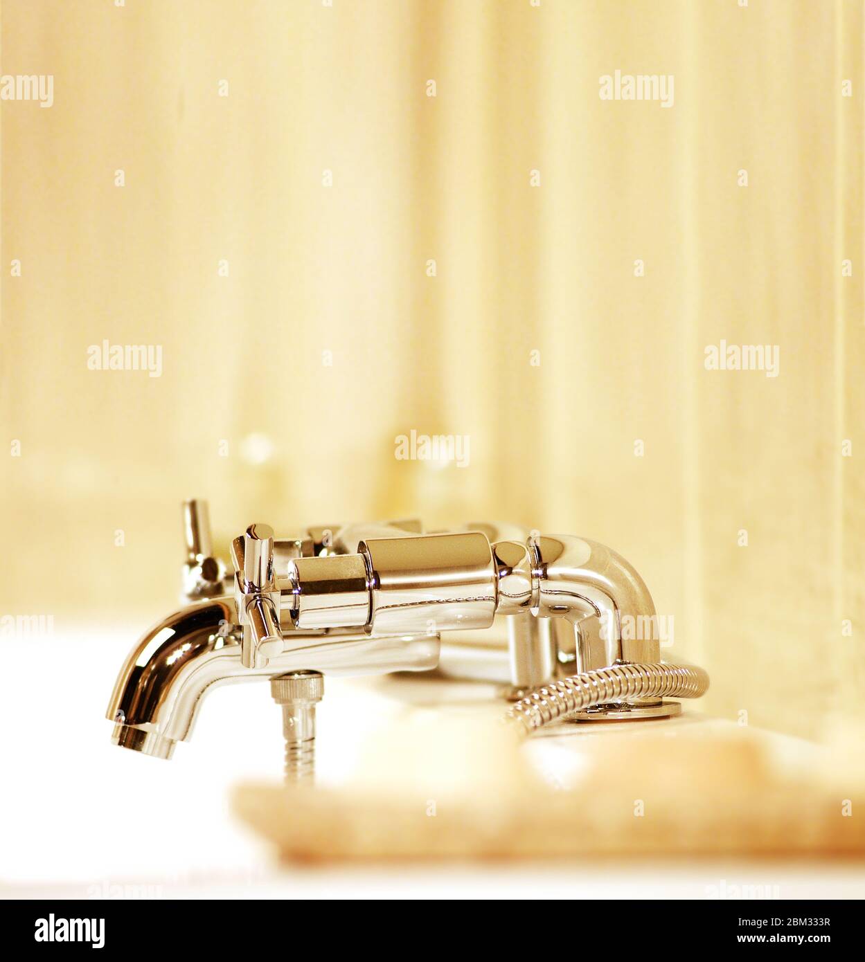 Close-up of a hot and cold mixer faucet on bathtub in a bathroom Stock Photo