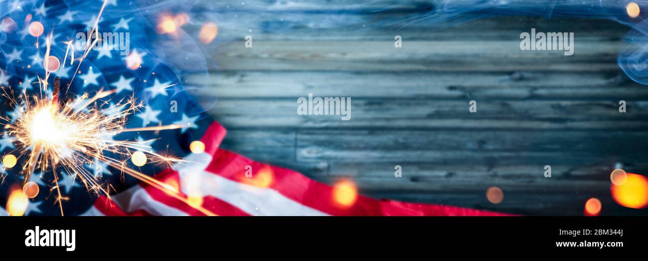 Happy 4th Of July - American Flag With Sparkler And Smoke On Wooden ...