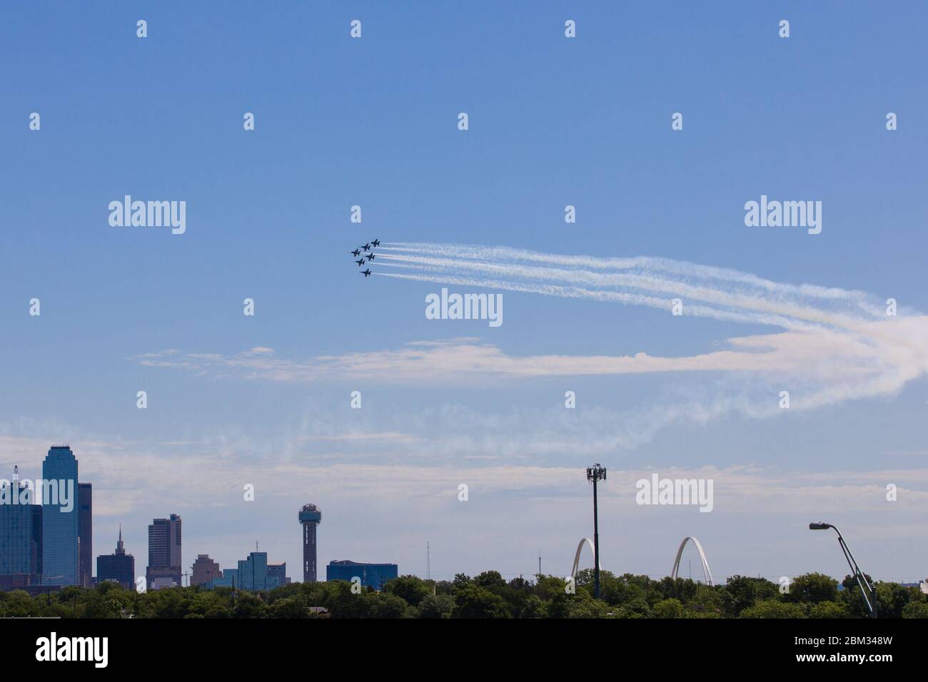 Dallas, USA. 6th May, 2020. A formation of the Blue Angels fly over Dallas and Fort Worth, Texas, the United States, on May 6, 2020. Jets from the U.S. Navy's Blue Angels flew over the southern states of Texas and Louisiana as a way to honor the frontline workers fighting the COVID-19 pandemic. The flyover started around noon in northern Texas Dallas-Fort Worth area and continued south over the largest Texas city of Houston and New Orleans in Louisiana. Credit: Dan Tian/Xinhua/Alamy Live News Stock Photo