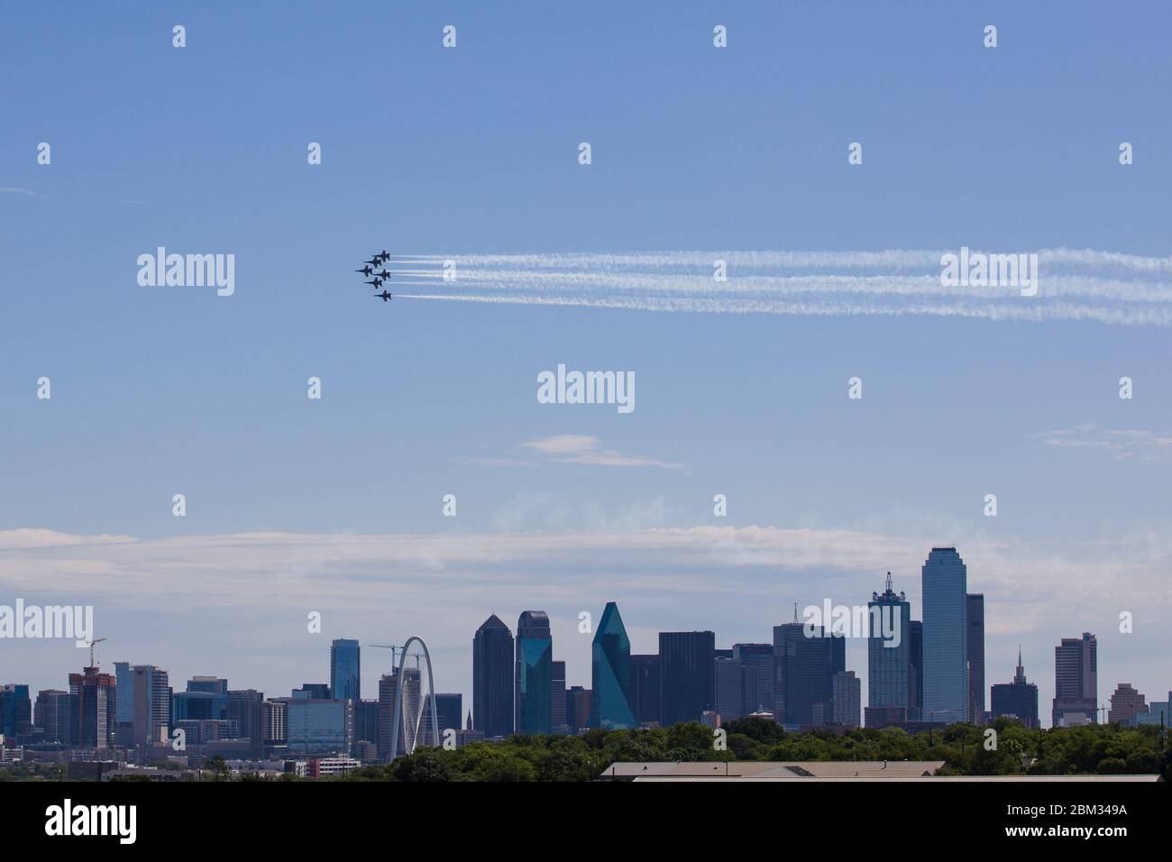 Dallas, USA. 6th May, 2020. A formation of the Blue Angels fly over Dallas and Fort Worth, Texas, the United States, on May 6, 2020. Jets from the U.S. Navy's Blue Angels flew over the southern states of Texas and Louisiana as a way to honor the frontline workers fighting the COVID-19 pandemic. The flyover started around noon in northern Texas Dallas-Fort Worth area and continued south over the largest Texas city of Houston and New Orleans in Louisiana. Credit: Dan Tian/Xinhua/Alamy Live News Stock Photo