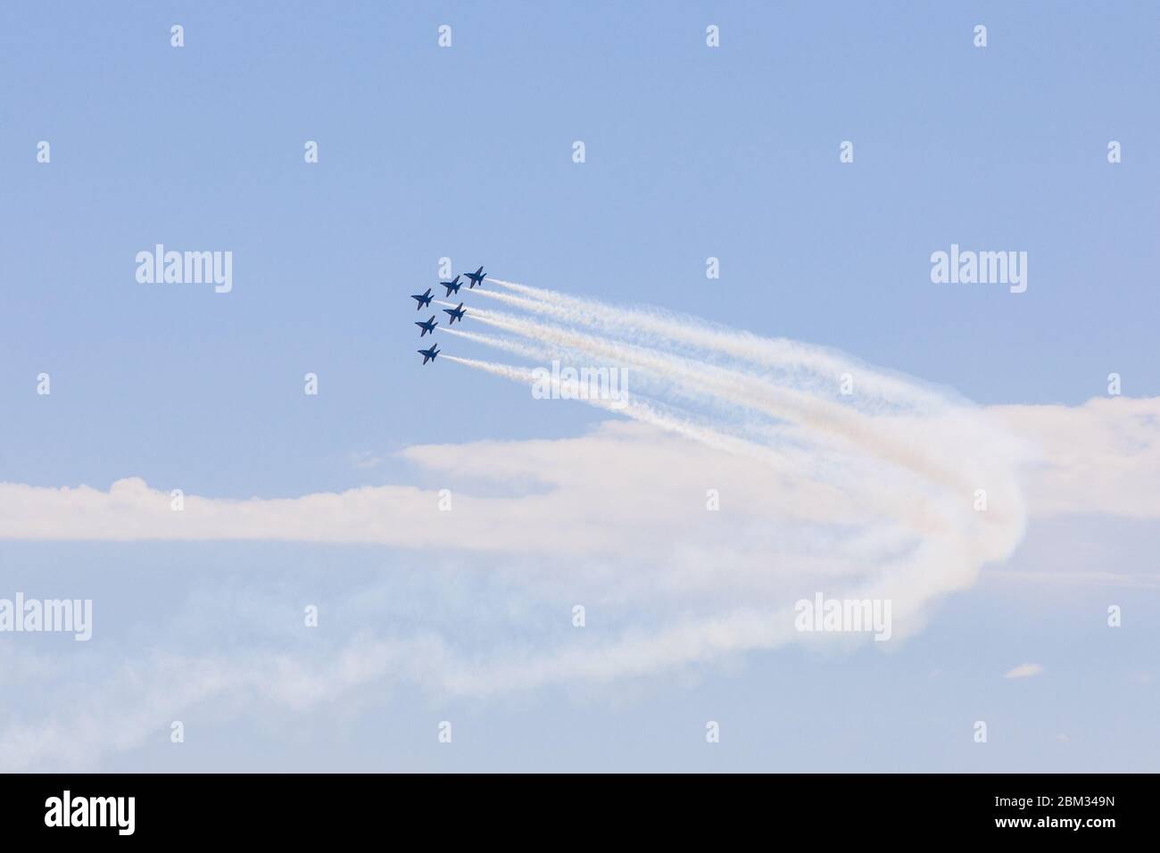 Dallas, USA. 6th May, 2020. A formation of the Blue Angels fly over Dallas and Fort Worth, Texas, the United States, on May 6, 2020. Jets from the U.S. Navy's Blue Angels flew over the southern states of Texas and Louisiana as a way to honor the frontline workers fighting the COVID-19 pandemic. The flyover started around noon in northern Texas Dallas-Fort Worth area and continued south over the largest Texas city of Houston and New Orleans in Louisiana. Credit: Dan Tian/Xinhua/Alamy Live News Stock Photo