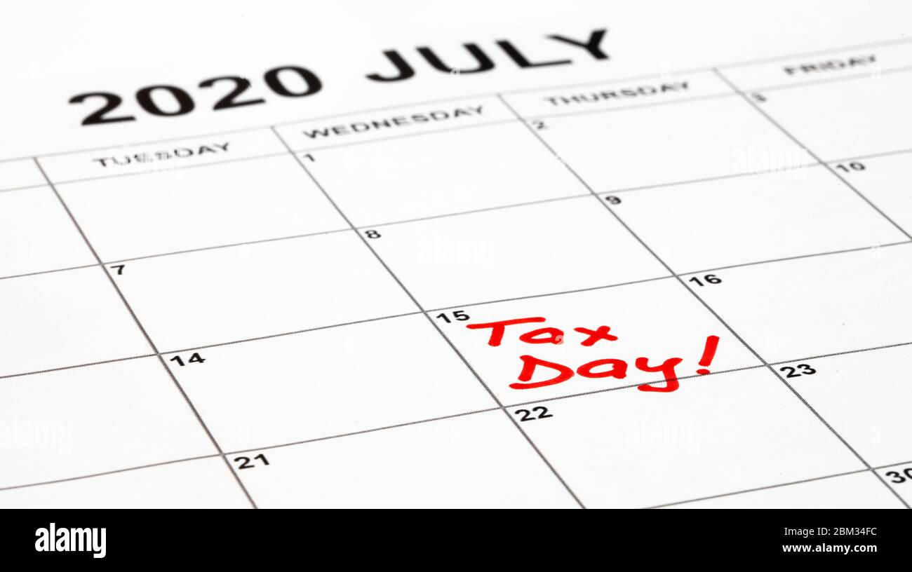 Taxes due date is set for 15th July 2020 due to corona virus outbreak. Calendar page with Tax Day written in red, remainder to pay taxes. Stock Photo