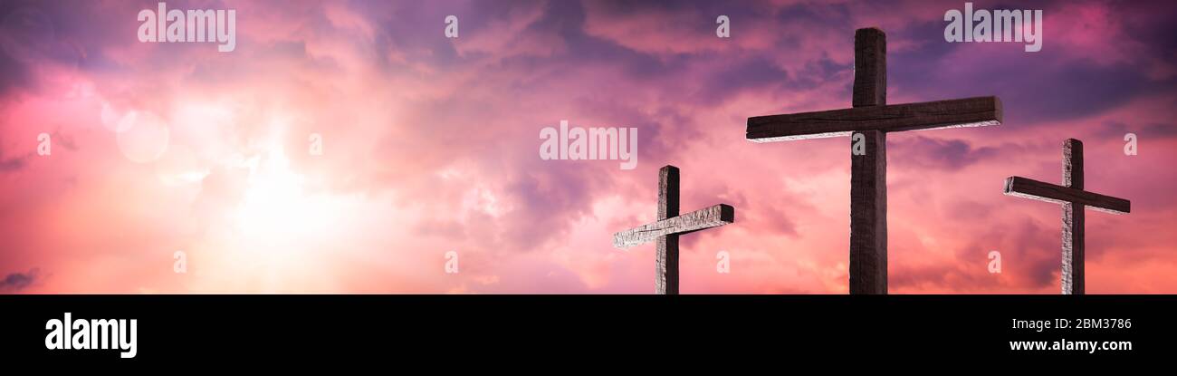Three Wooden Crosses With Sunrise And Clouds Background - Death And Resurrection Of Jesus Christ Stock Photo