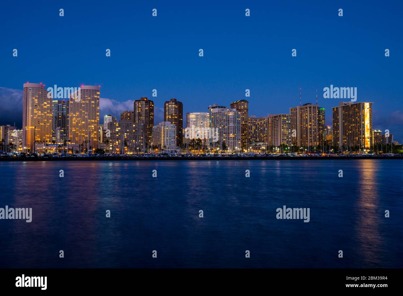 Night view of Honolulu skyline at blue hour, Oahu, Hawaii Stock Photo