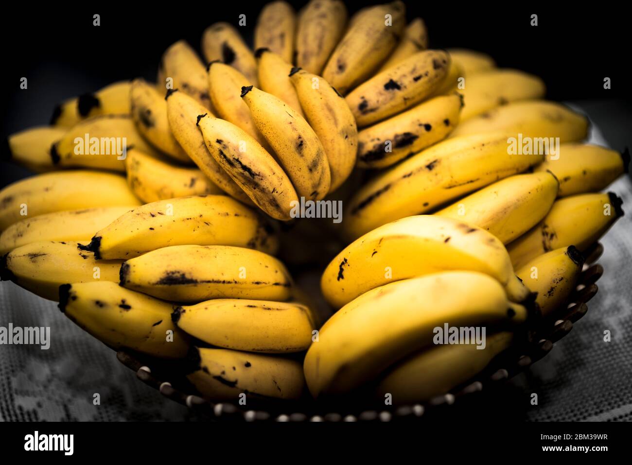 A bunch of yellow bananas in a basket Stock Photo