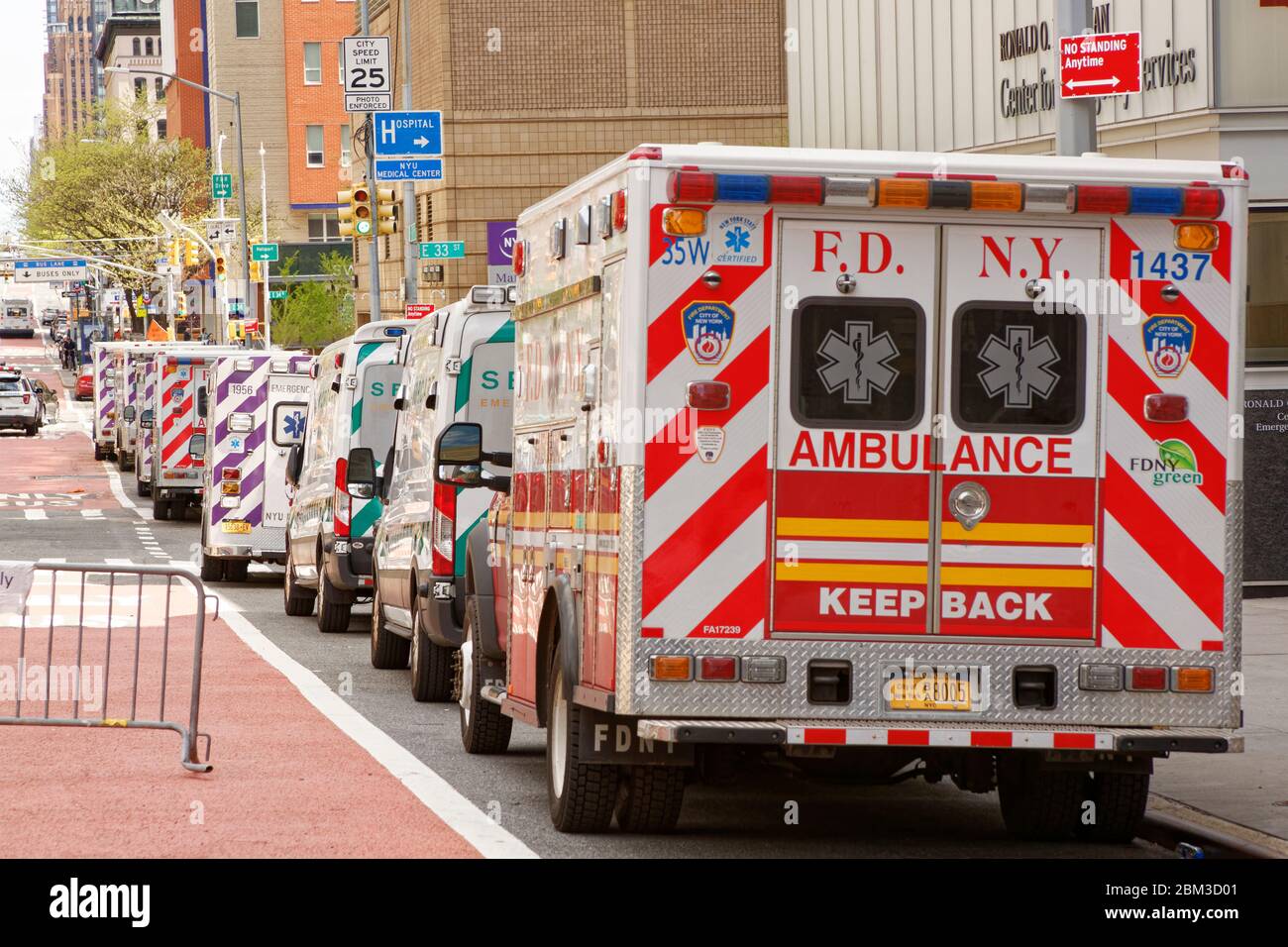 Ambulances line up outside a NYC hospital emergency room waiting for the next spike in calls Stock Photo