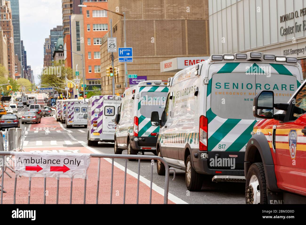 Ambulances line up outside a NYC hospital emergency room waiting for the next spike in calls Stock Photo
