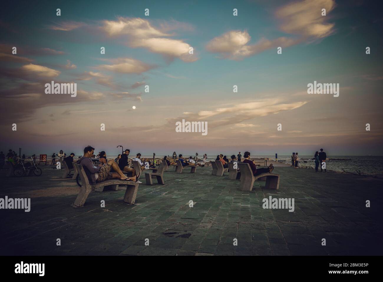 Barcelona Spain 6th May Commuters Sit At Barcelona S Beach In The Early Evening During The