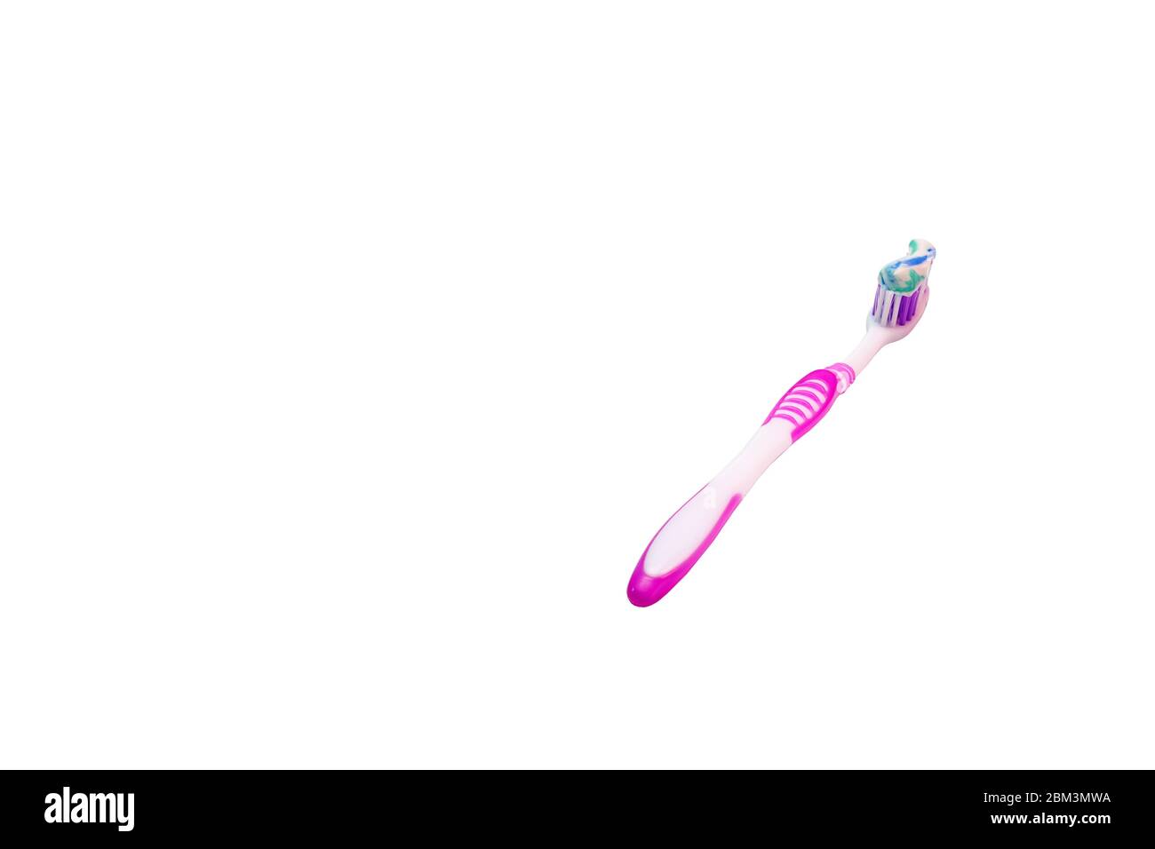 pink toothbrush isolated . daily care of the oral cavity Stock Photo
