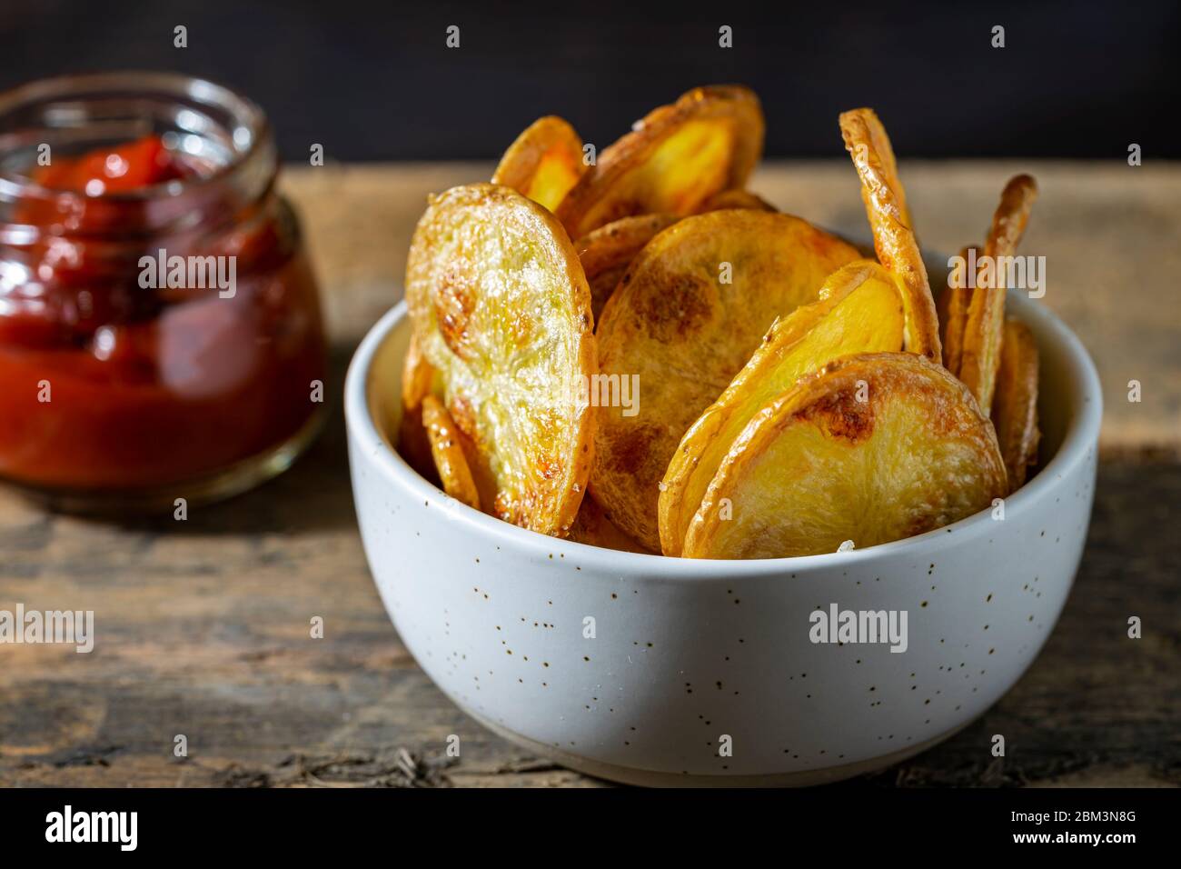 Homemade oven fried potato chips Stock Photo Alamy
