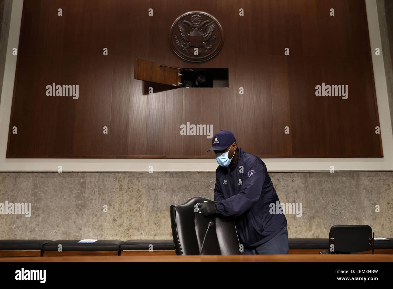 Washington, United States Of America. 06th May, 2020. Workers wipe down chairs between Senate committee hearings in the Dirksen Senate Office Building on Capitol Hill during the coronavirus disease (COVID-19) outbreak in Washington, U.S. May 6, 2020. Credit: Jonathan Ernst/Pool via CNP | usage worldwide Credit: dpa/Alamy Live News Stock Photo