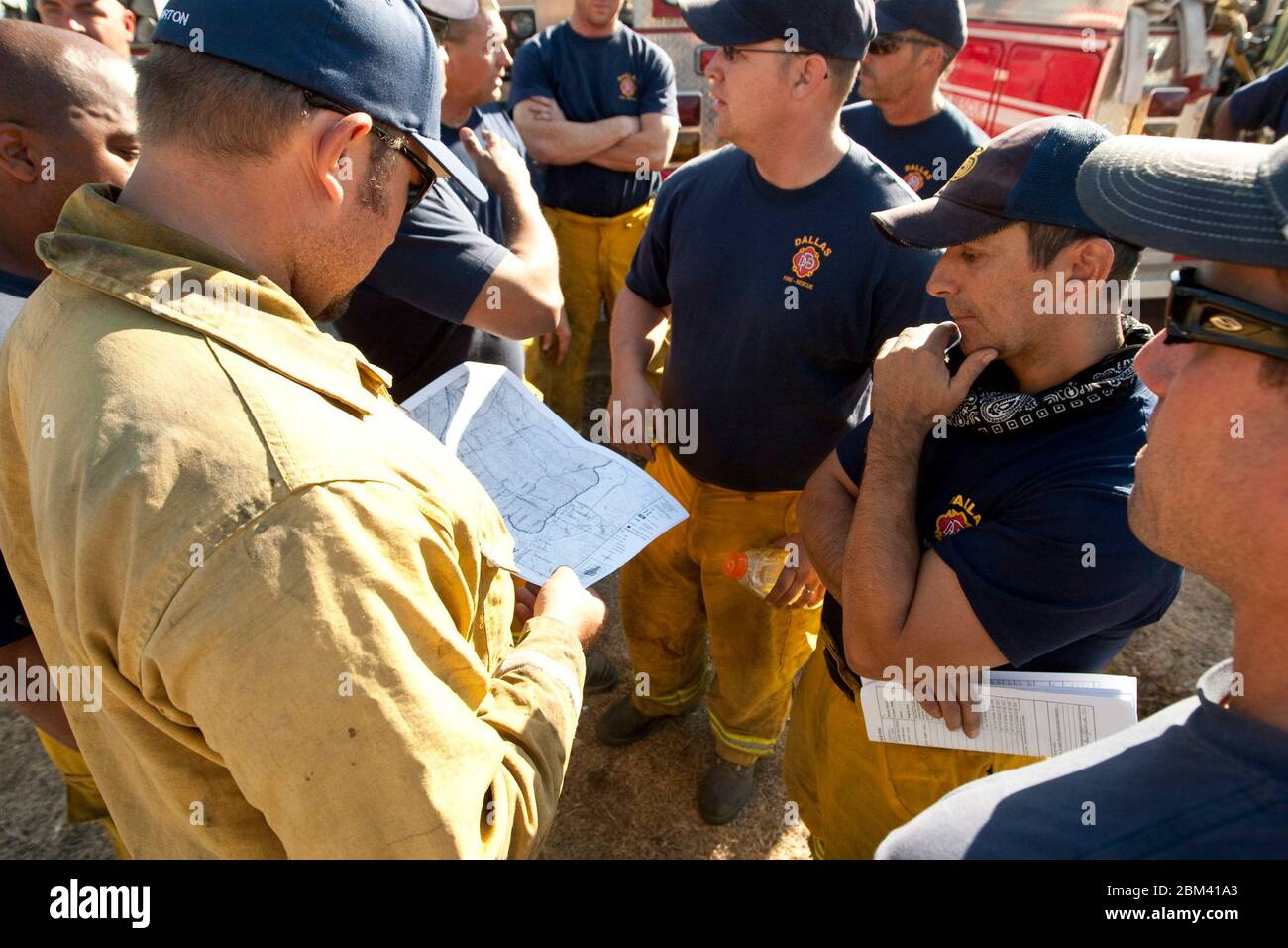 Bastrop, Texas USA, September 9, 2011: Firefighters from Dallas, Texas, gather outside the Bastrop Convention Center before being sent out to rural areas that were struck by massive wildfires in early September. Firefighters from around the state came to the aid of overwhelmed local officials. ©Marjorie Kamys Cotera/Daemmrich Photography Stock Photo