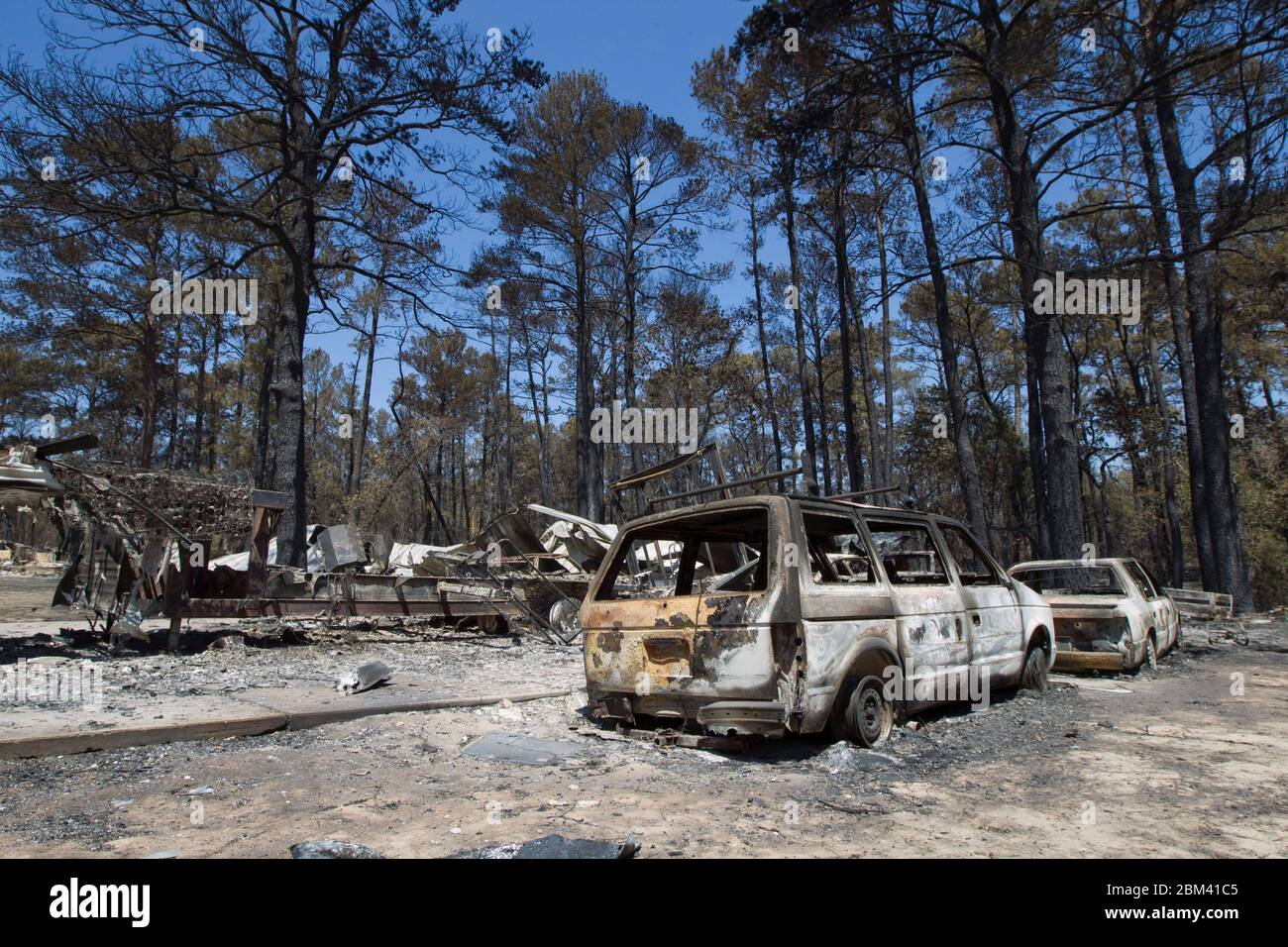 Bastrop County Texas USA, September 9, 2011: The aftermath of wildfire through the piney woods in Bastrop County 30 miles east of Austin is shown in these destroyed vehicles. The fires destroyed more than 1,400 houses and scorched more than 38,000 acres while it was out of control for five days. ©Bob Daemmrich Stock Photo