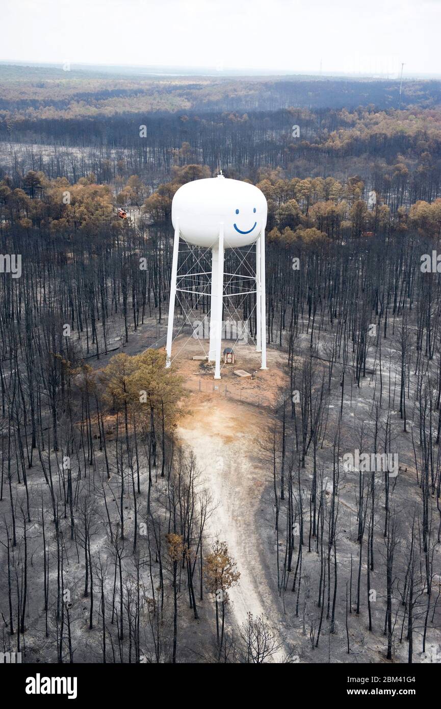 Bastrop County Texas USA, September 2011: Aerial of fire damage where wildfires last week claimed 38,000 acres and over 1,500 homes with two deaths reported.  The trees in Bastrop State Park were the hardest hit with over 95% of the park acreage blackened or destroyed.  ©Bob Daemmrich Stock Photo