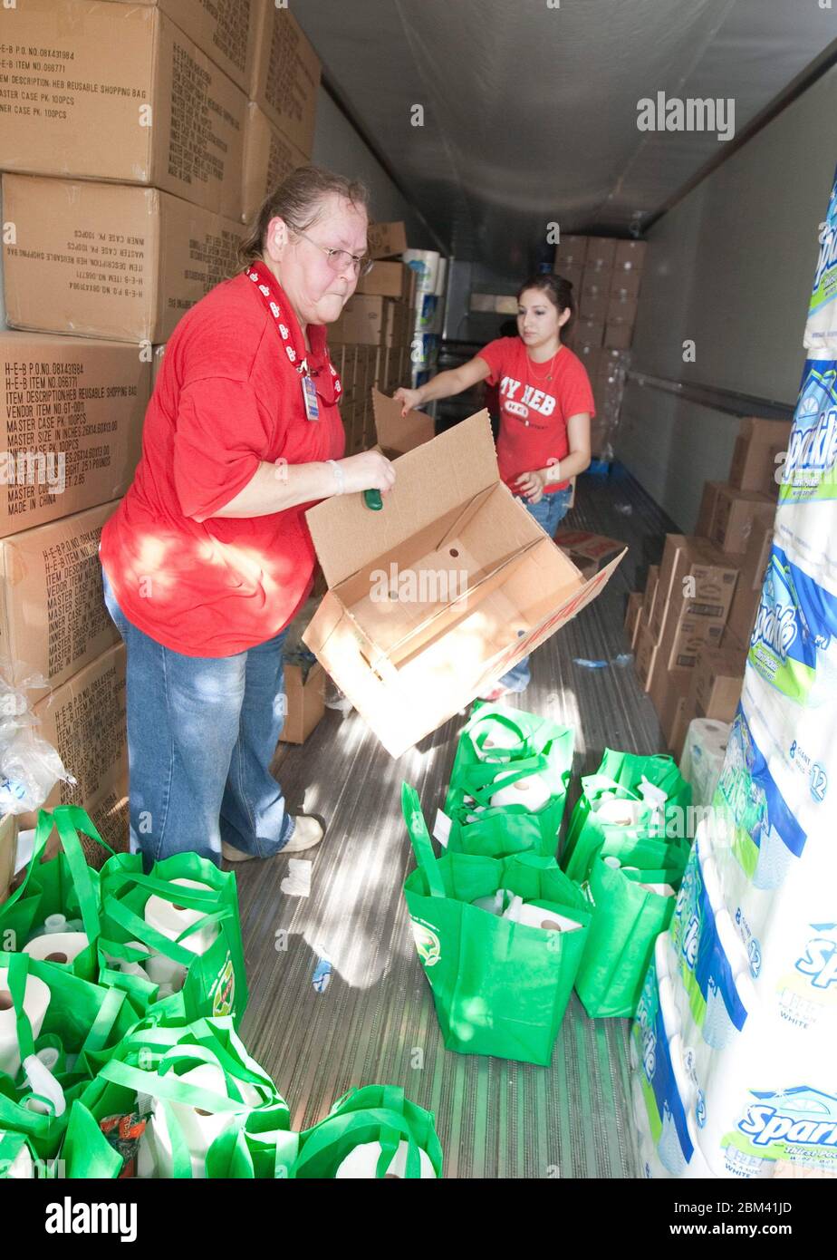 Bastrop Texas USA, September 13 2011: Volunteers from Texas supermarket chain H.E.B. give away bags of cleaning supplies for residents after massive wildfires swept through the area, burning more than 1400 homes.  ©Marjorie Kamys Cotera/Daemmrich Photography Stock Photo