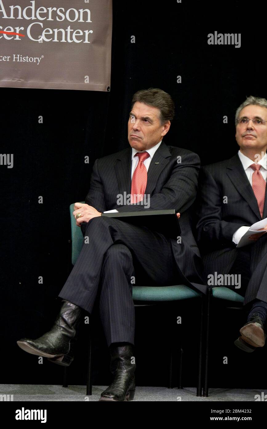 Houston, Texas USA, November 28, 2011: Texas Gov. Rick Perry sits next to Dr. Ronald DePinho, president of the University of Texas MD Anderson Cancer Center, at a press conference announcing the new Institute for Applied Cancer Science at MD Anderson Cancer Center. © Marjorie Kamys Cotera/Daemmrich Photography Stock Photo