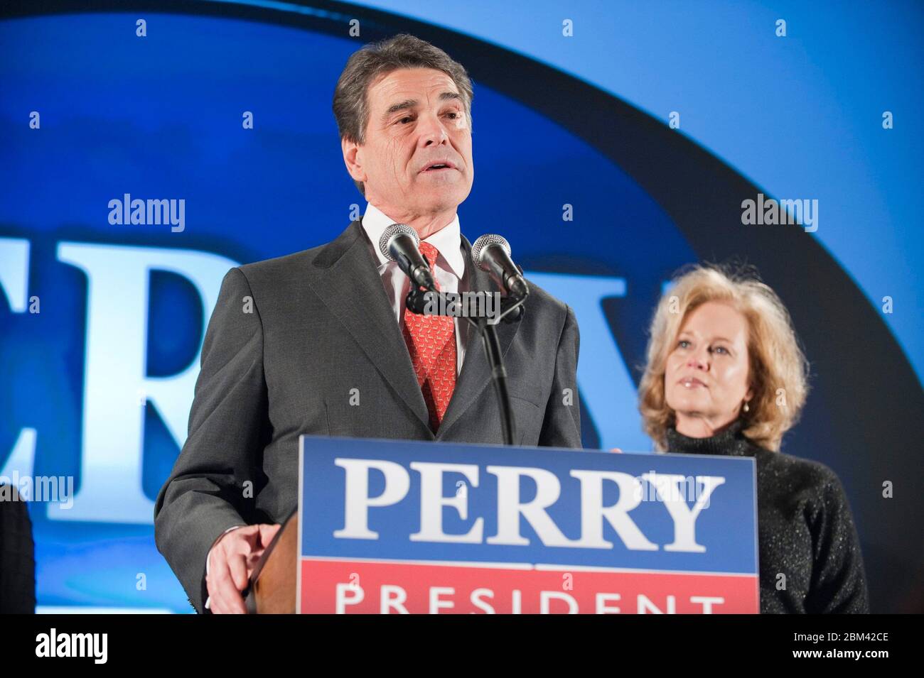 West Des Moines , Iowa  USA, January 3, 2012: Rick Perry, Texas governor and candidate for the Republican presidential nomination, announces that he is temporarily suspending his campaign and returning to Texas to assess the future. Perry's wife Anita stands to the right. ©Bob Daemmrich Stock Photo