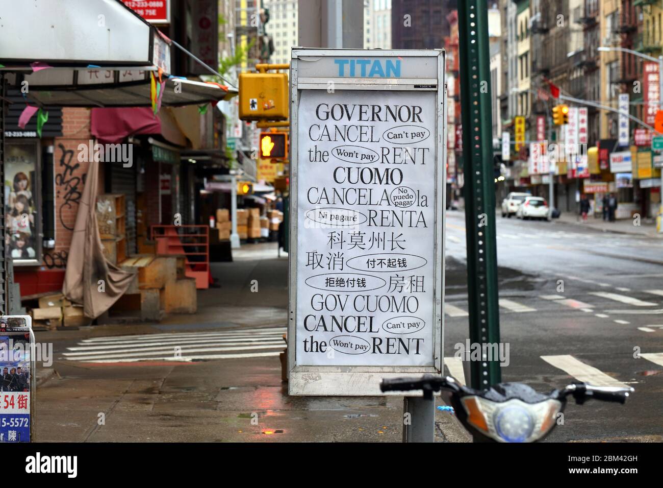 A 'Cancel Rent Cuomo' poster inside a telephone booth in Manhattan Chinatown in New York during coronavirus... SEE MORE INFO FOR FULL CAPTION Stock Photo