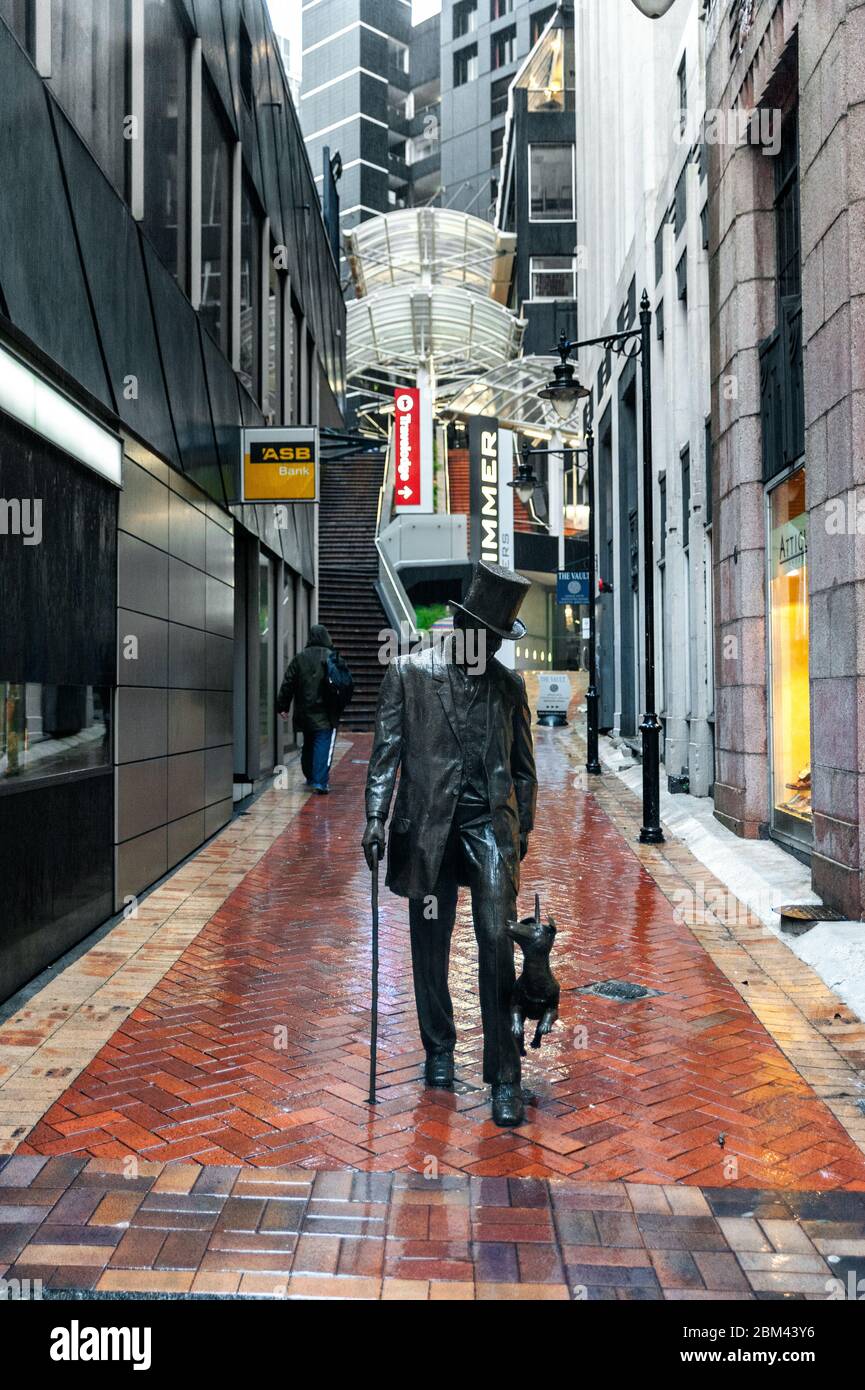 Statue of John Plimmer, city founder, on Plimmer Steps, Lambton Quay, Wellington, New Zealand in rainy weather in winter Stock Photo