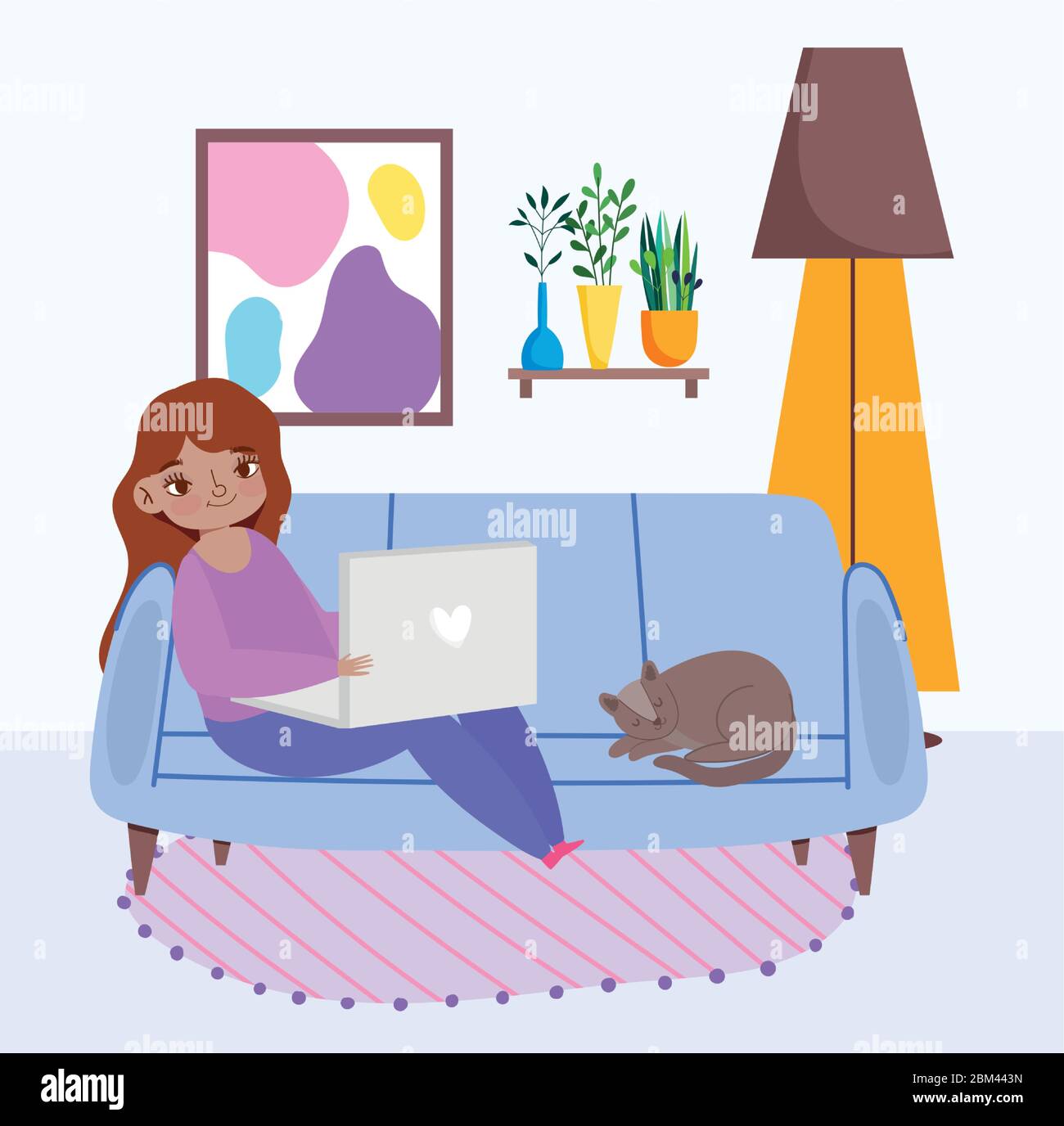 working remotely, young woman sitting on sofa with laptop and cat ...