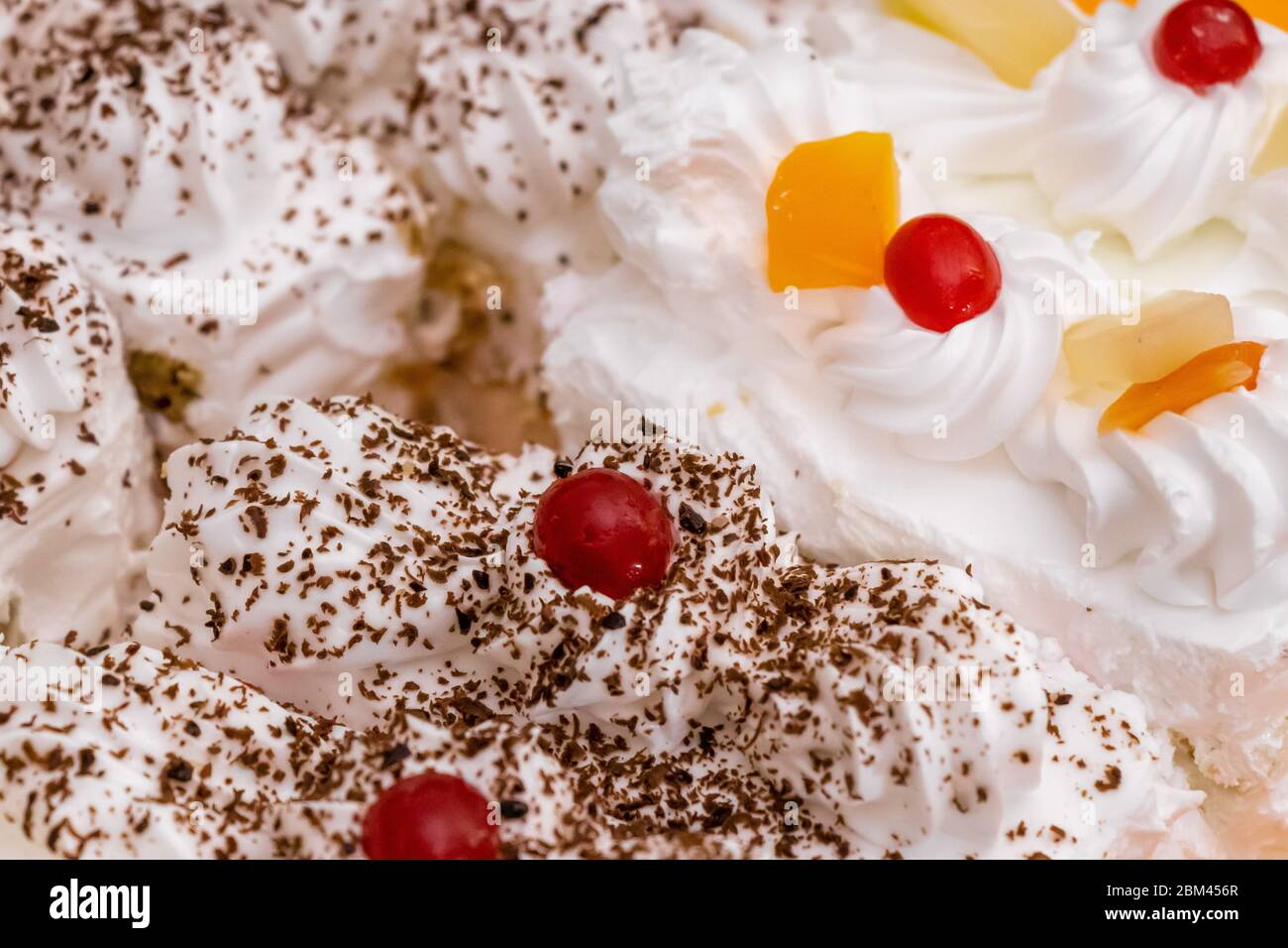 Tasty piece of chocolate vanilla cake pastry closeup, selective focus. Stock Photo