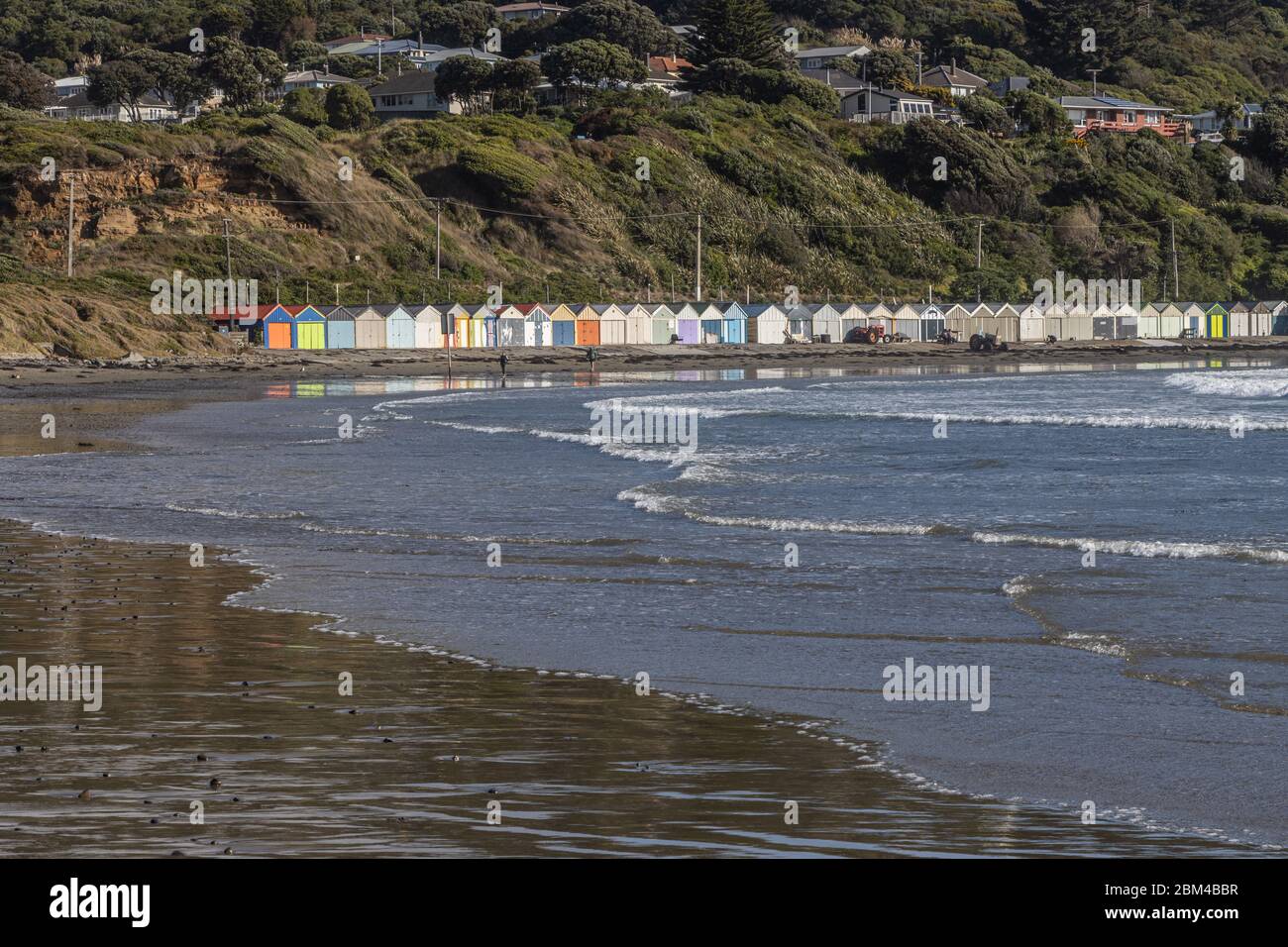 View across Titahi Bay to boatsheds during first week of Level Three Lockdown Restrictions Stock Photo