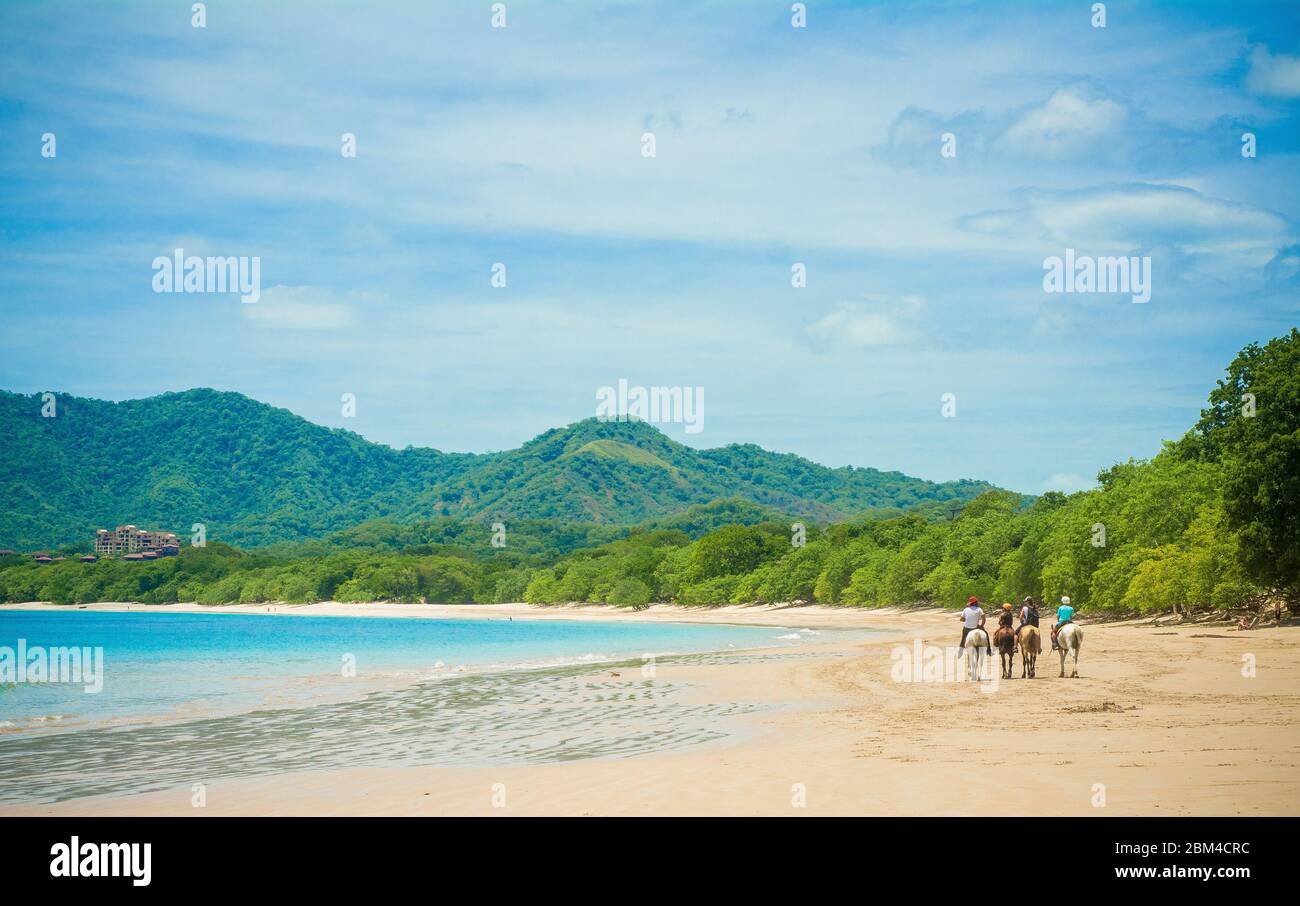 horseback riding at the beach in Costa Rica Stock Photo Alamy