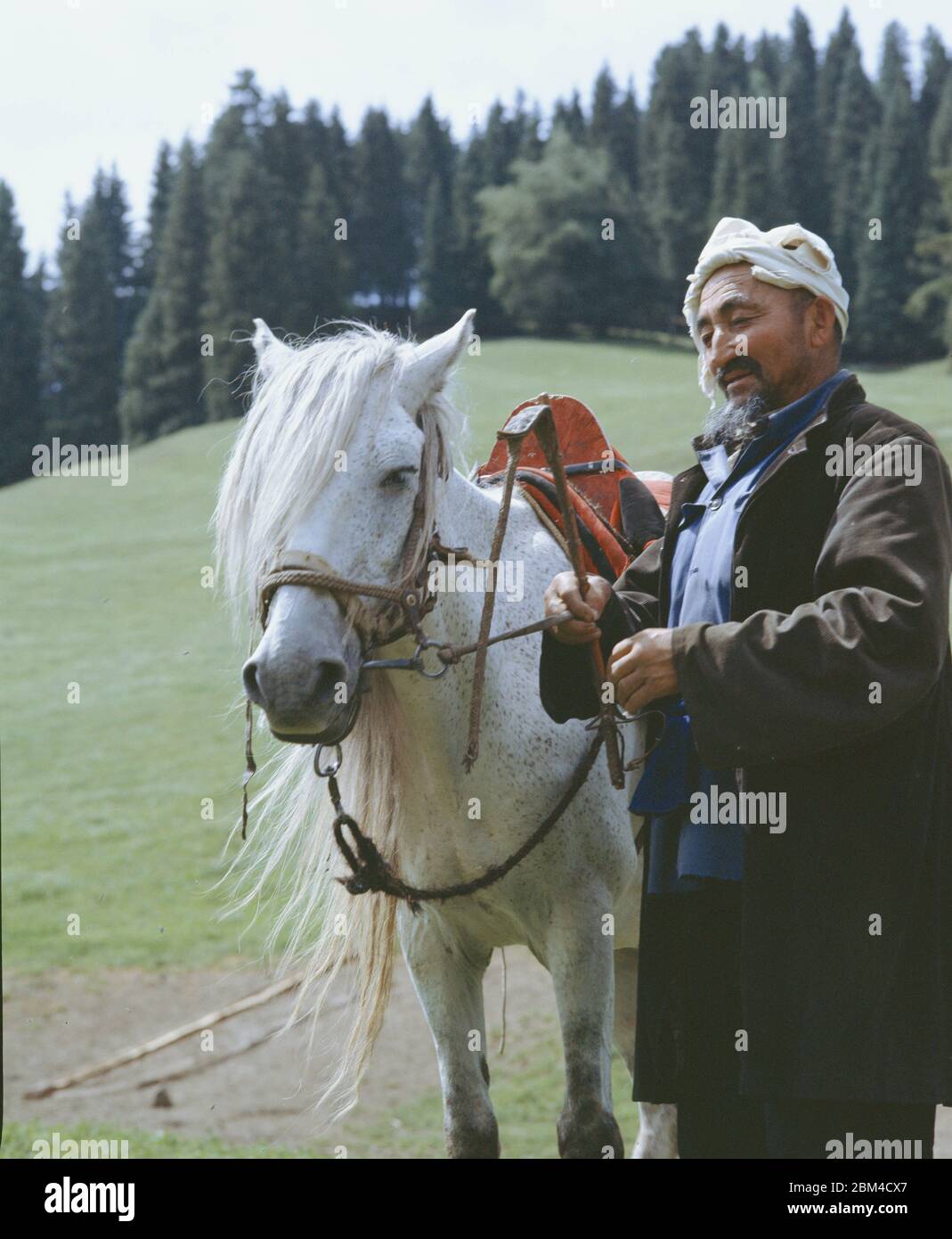 In June 2005 an old herdsman in the Tianshan pastoral area Mulei Kazakh Autonomous County Xinjiang Changji Hui Autonomous Prefecture Stock Photo