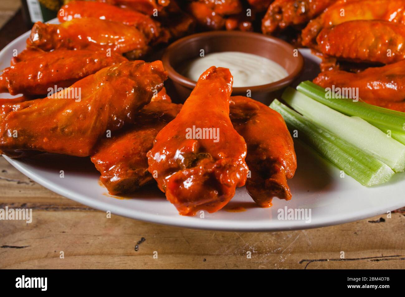 chicken wings spicy food and cheese dip american pub close up Stock Photo -  Alamy