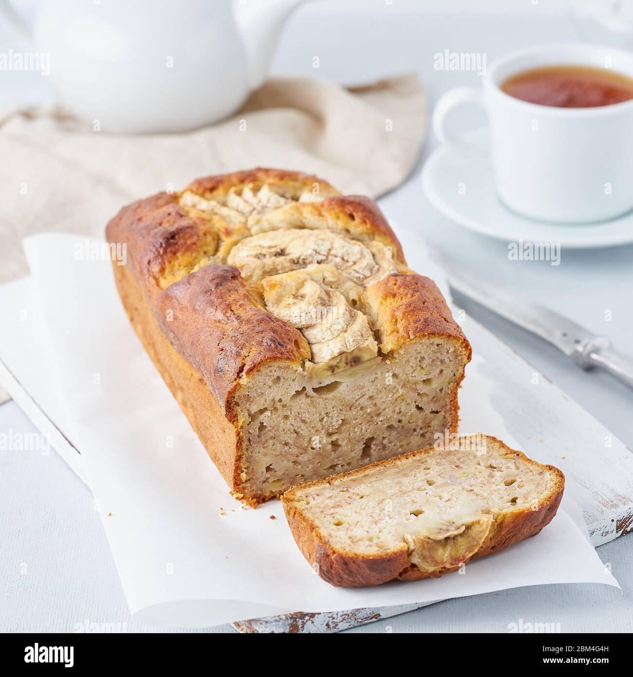 Banana bread, cake with banana, side view, vertical. The morning Breakfast with tea Stock Photo