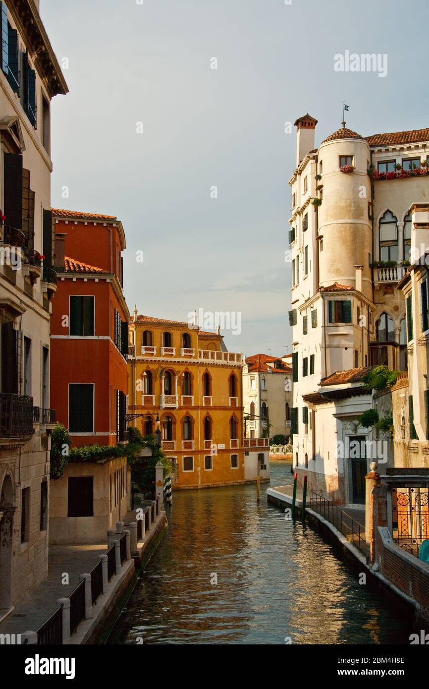 Typical architecture next to one of many canals in Venice Stock Photo