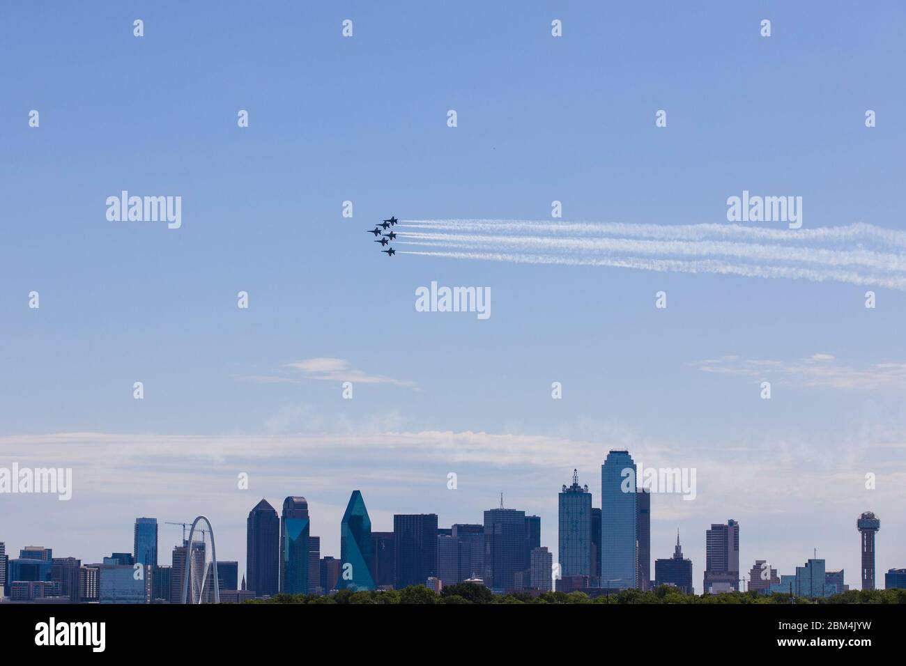 Beijing, USA. 6th May, 2020. A formation of the Blue Angels fly over Dallas and Fort Worth, Texas, the United States, on May 6, 2020. Jets from the U.S. Navy's Blue Angels flew over the southern states of Texas and Louisiana as a way to honor the frontline workers fighting the COVID-19 pandemic. The flyover started around noon in northern Texas Dallas-Fort Worth area and continued south over the largest Texas city of Houston and New Orleans in Louisiana. Credit: Dan Tian/Xinhua/Alamy Live News Stock Photo