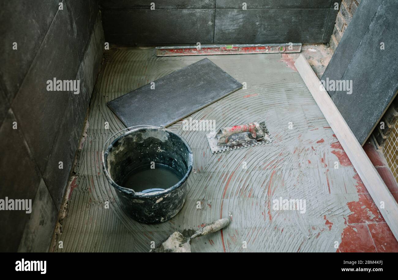 Tile laying work on floor Stock Photo