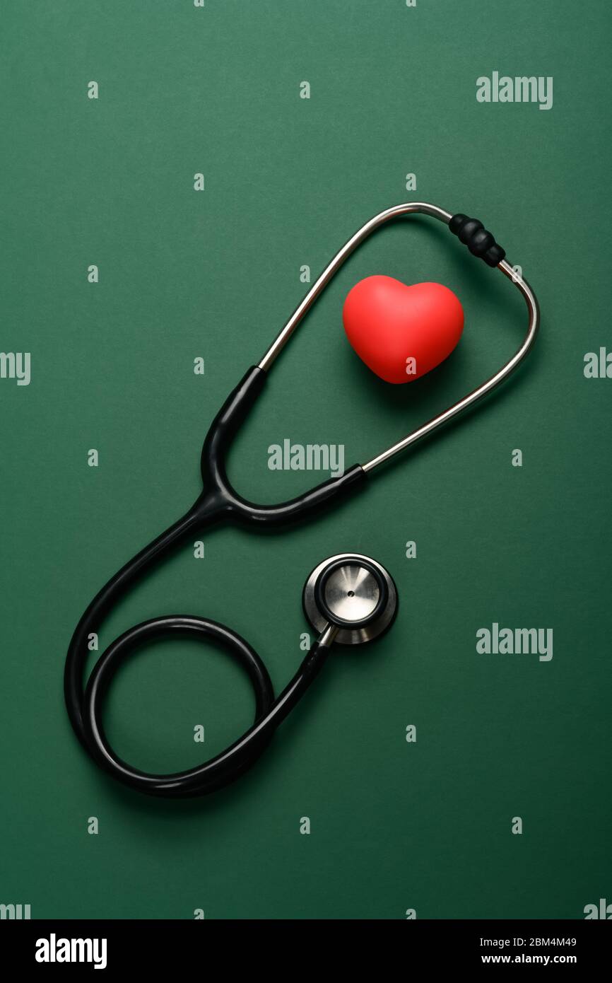 top view heart and stethoscope on a green background Stock Photo - Alamy