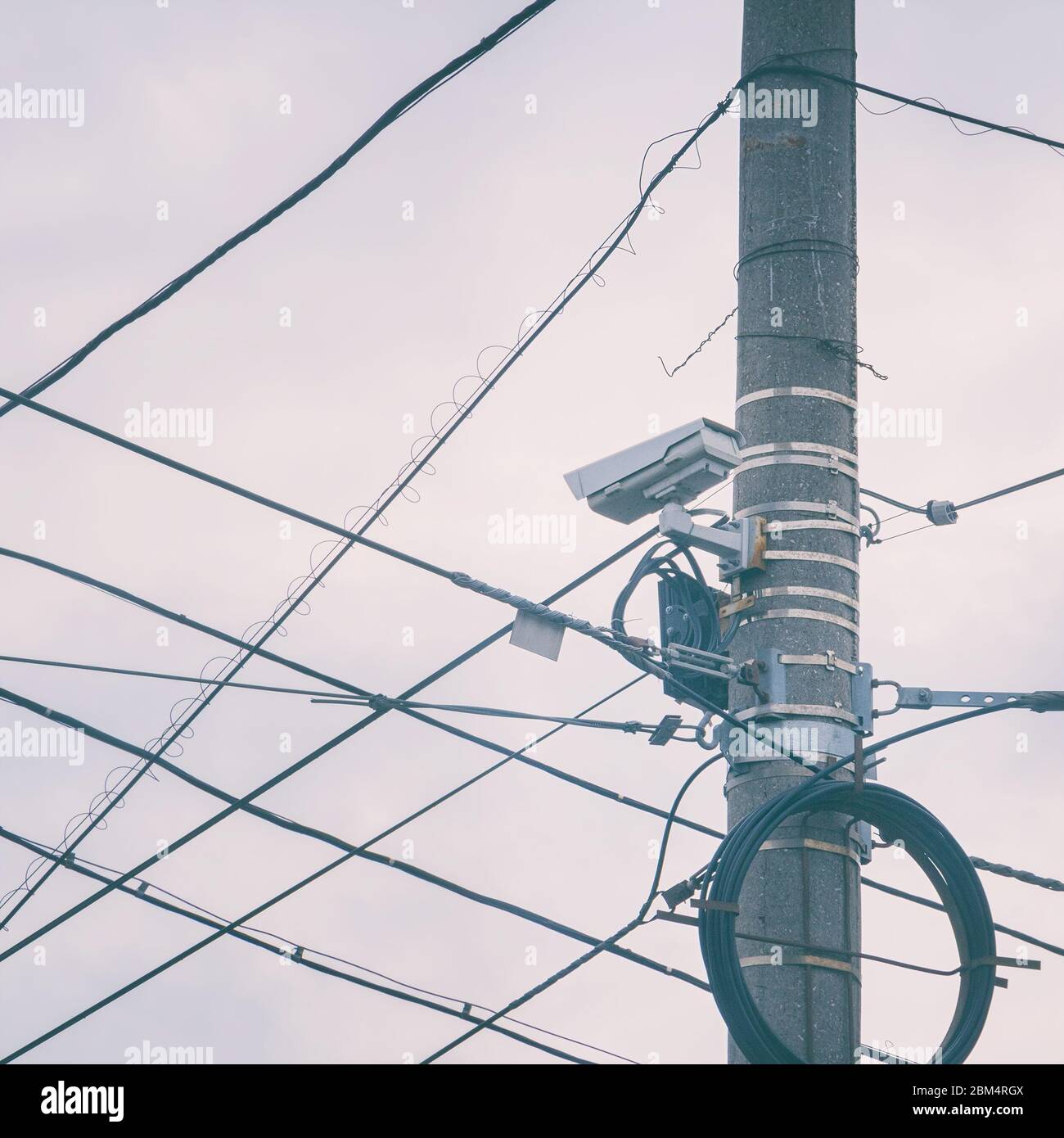 Outdoor surveillance camera on a pole with cables Stock Photo Alamy