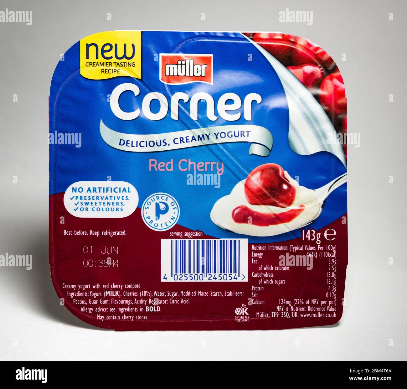 Muller fruit corner yogurt,red cherry,143g retail packaging Stock Photo