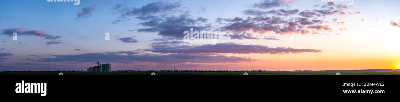 Sunset panorama with beautiful sky and clouds Stock Photo - Alamy