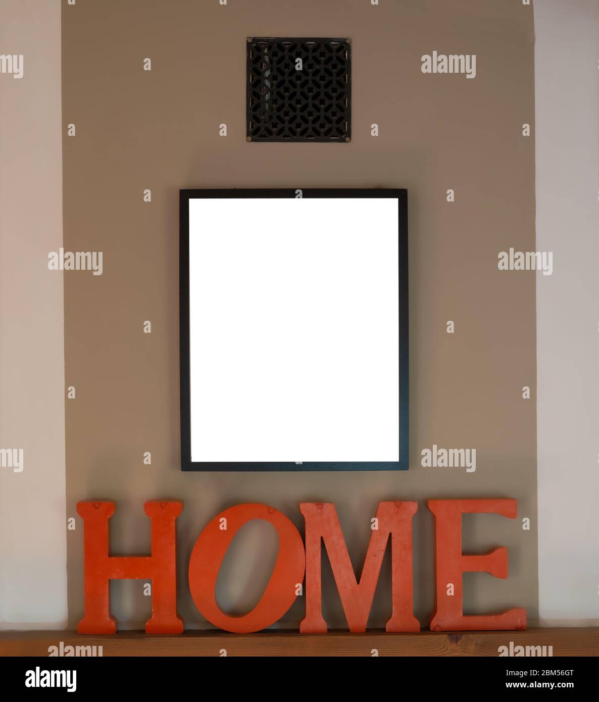 Mock up black picture frames on cream wall with home as a decoration