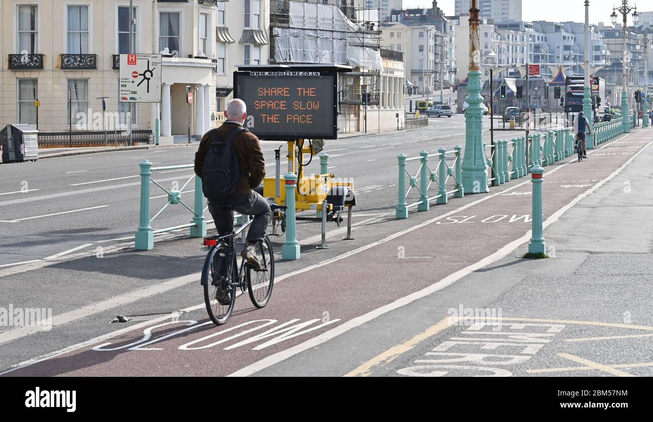 Brighton UK 7th May 2020 - A message to cyclists along Brighton seafront on a beautiful sunny morning during the Coronavirus COVID-19 pandemic crisis . The weather is forecast to be hot and sunny over the next few days before turning cooler at the weekend . Credit: Simon Dack / Alamy Live News Stock Photo