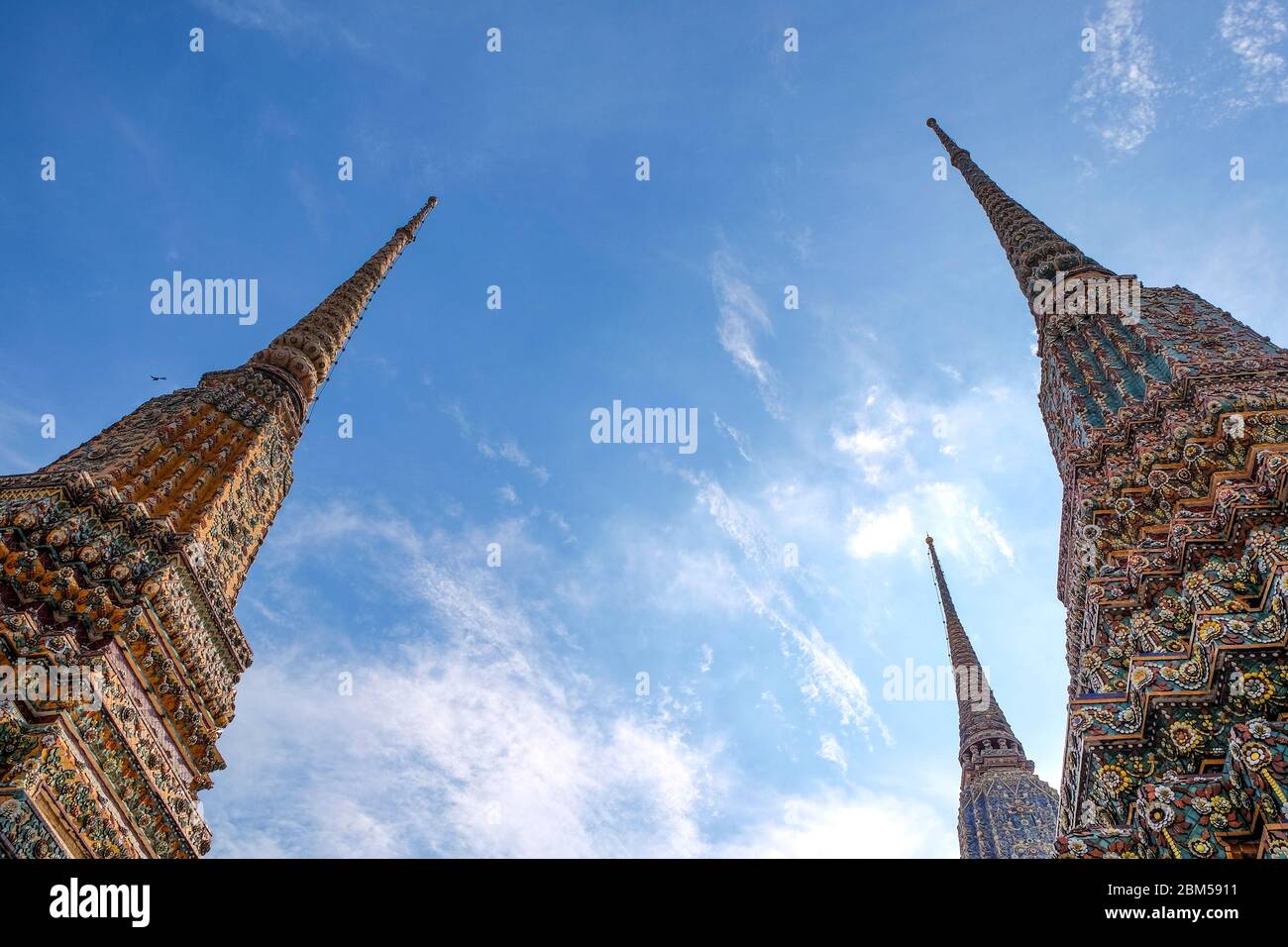 Phra Maha Chedi Four Kings on uprisen angle in daytime, A large and tall pagoda built as the reign of King Rama I 1-4, Bangkok, Thailand Stock Photo