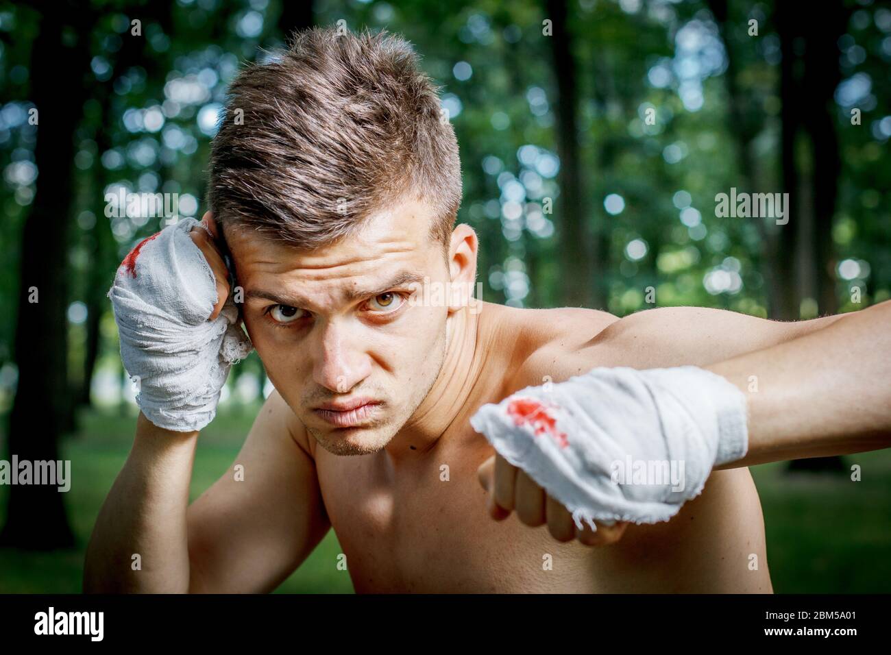 aggressive boxer diligently trains hands in blood Stock Photo - Alamy